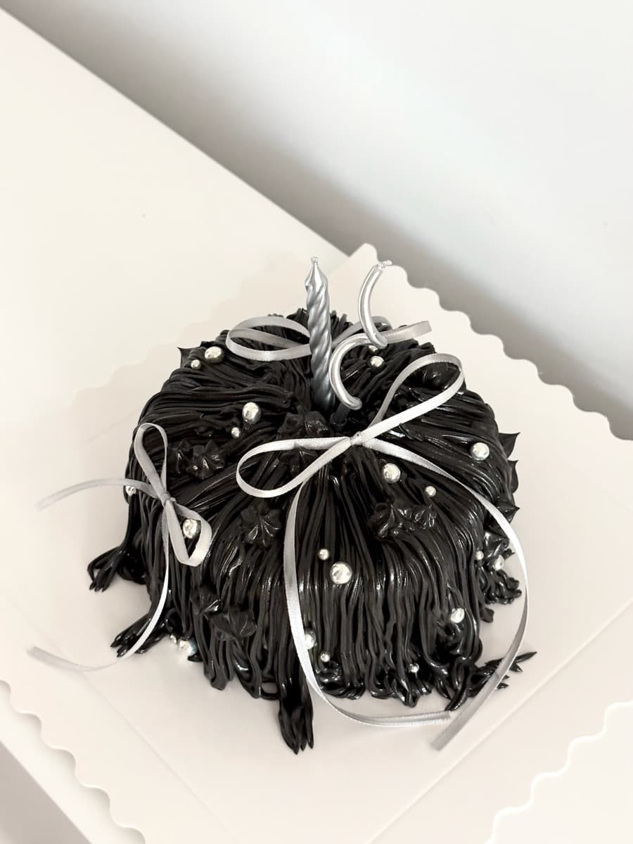Dramatic black textured cake, silver accents