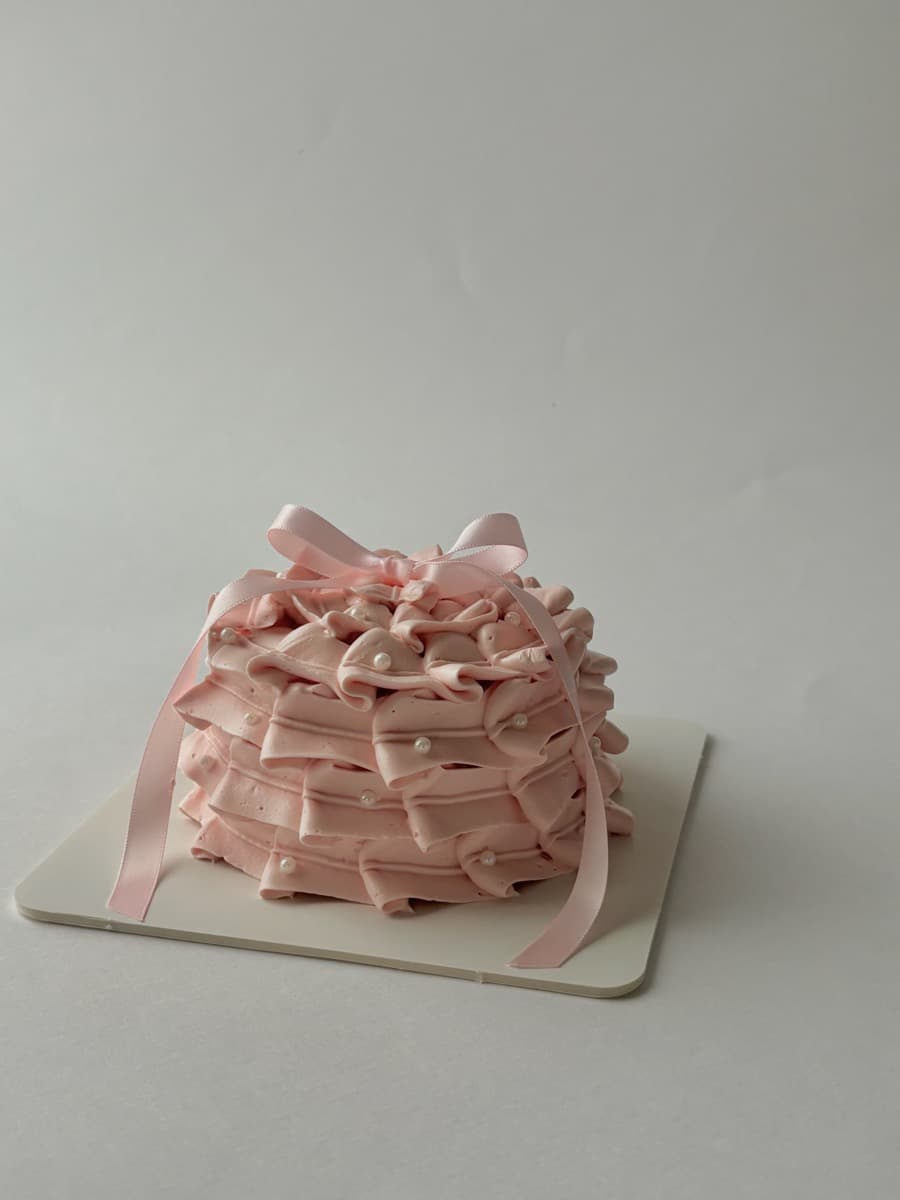 Blush ruffles with scattered pearl details