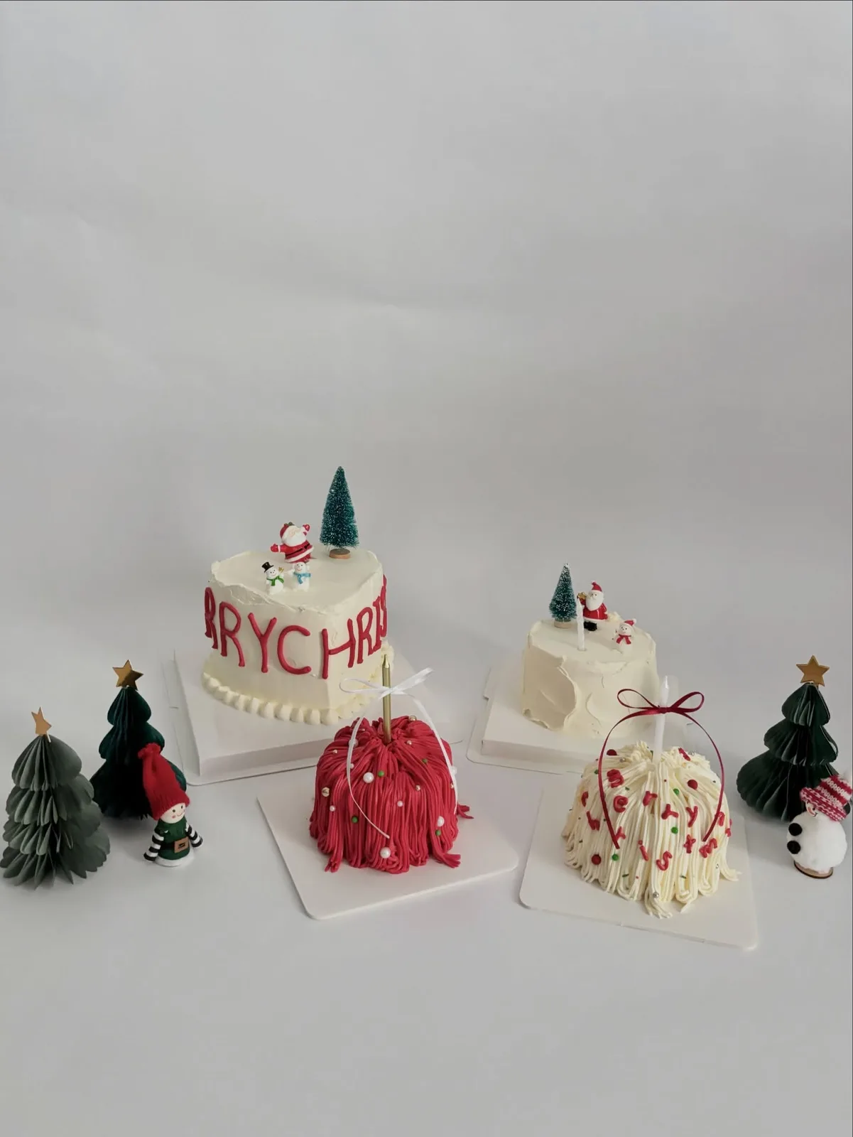 Christmas cake set with piped trees and snowman, custom cake made in Streatham SW16 - Danine Cakes