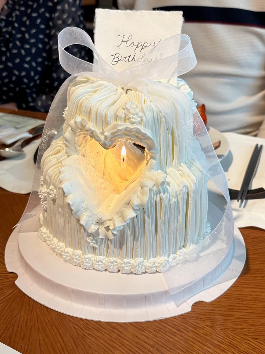 White fluffy heart — candlelit at the table