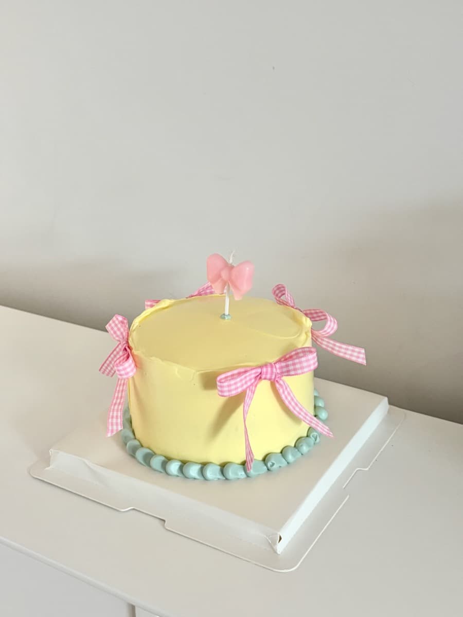 Soft yellow with gingham pink bows