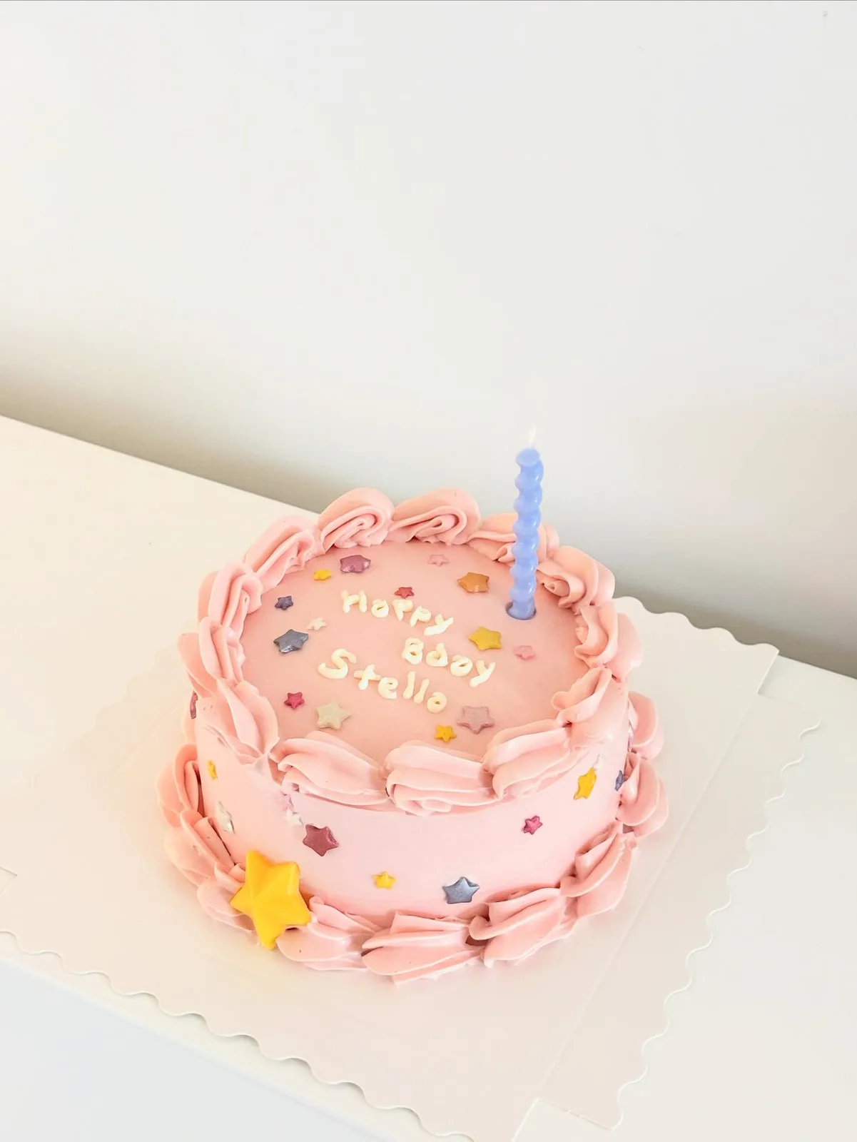 Pink cake with pastel sprinkles and star candle, custom cake made in Streatham SW16 - Danine Cakes