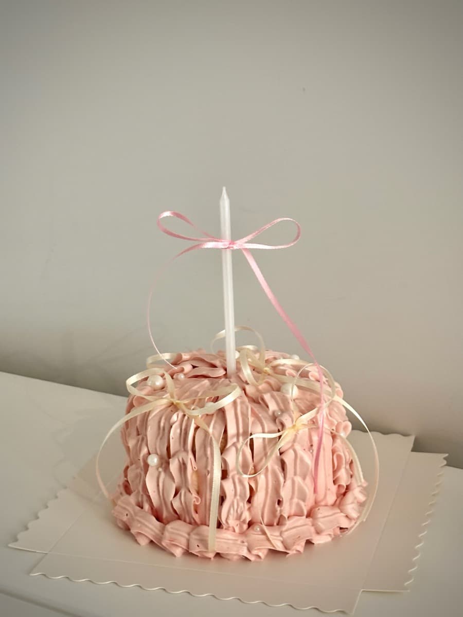 Pink fluffy dome with ivory satin ribbons
