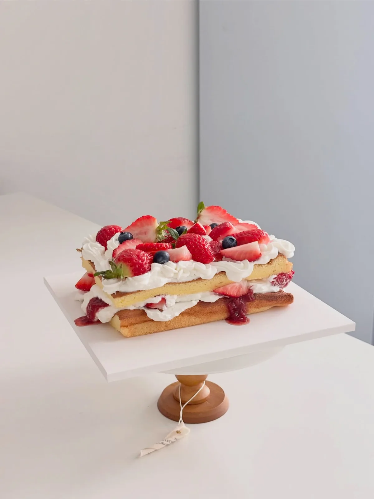 Strawberry and berry layered cream cake, handmade to order by Danine Cakes in Streatham, South London